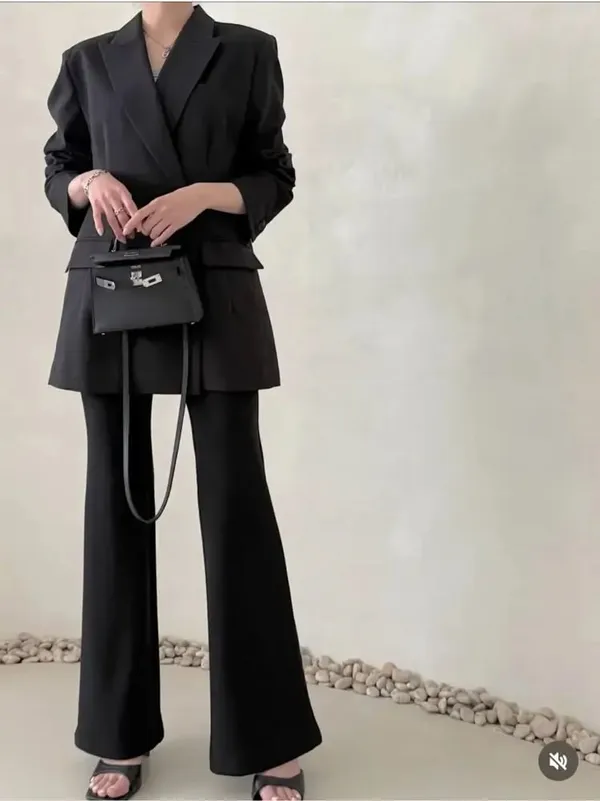 Stylish Black Suit Jacket, Showcasing Elegance and Charm