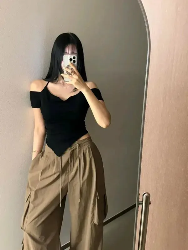 Stylish Black Off-Shoulder Top, Showcasing Elegant Charm
